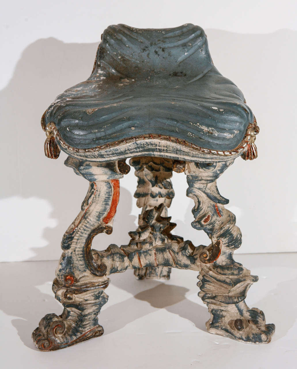 Hand-carved and painted, parcel gilt, Venetian grotto chair with faux drapery and tassels.