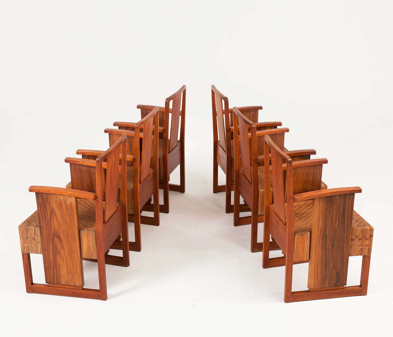 Interesting set of 6 Art Deco armchairs with solid wooden frame and cubistic shaped seats with woven cane upholstery.

The seats have been woven in an interesting pattern.

The wooden surface has been restored and the construction is completely
