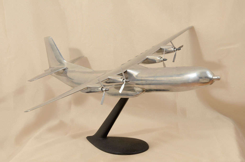This large aluminum model is a replica of a Douglas C-133 Cargomaster. The C-133 was a large cargo aircraft built between 1956 and 1961 by the Douglas Aircraft Company for use with the United States Air Force. It was the USAF's only production