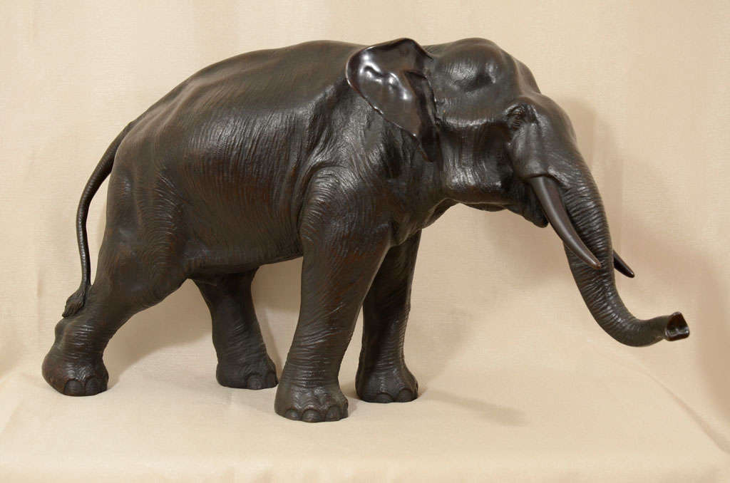 Large and impressive, this piece is a beautiful example of a high quality Japanese bronze sculpture. Remarkably detailed, the artisan has captured the elephant in a very natural and tranquil pose. The life-like rendering of the wrinkled skin is