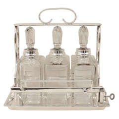 Tantalus Set with Three Decanters by Hukin & Heath