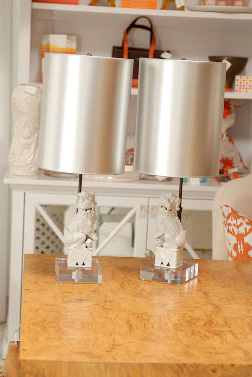 * custom lamps made from vintage foo dogs<br />
* small vintage white foo dogs measure 9H x 3W x 4D<br />
* rectangle lucite base measures 1H x 5W x 6D<br />
* custom hand painted cylinder shades<br />
* black rod runs vertical from lucite base