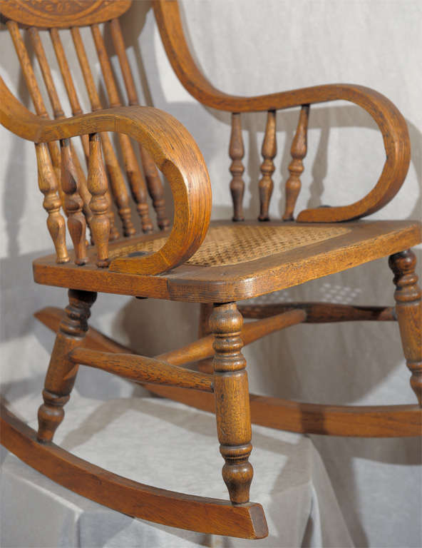 antique rocking chair with round leather seat