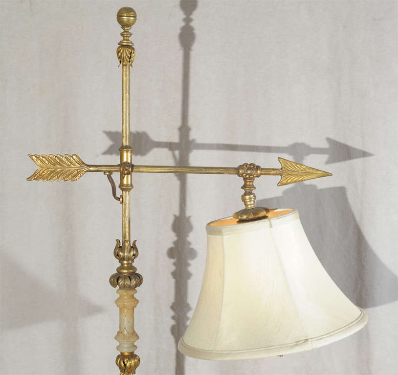This very unique and extremely high quality bridge lamp is one of the finer ones we have offered.  Note the alabaster segments along the bottom and center shaft which adds to this nice design.  The angle of the shade adjusts.  The shade itself is