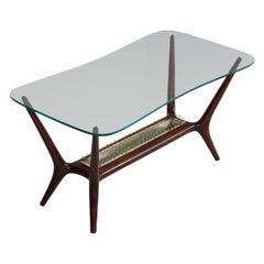 Italian cocktail table with curved glass top