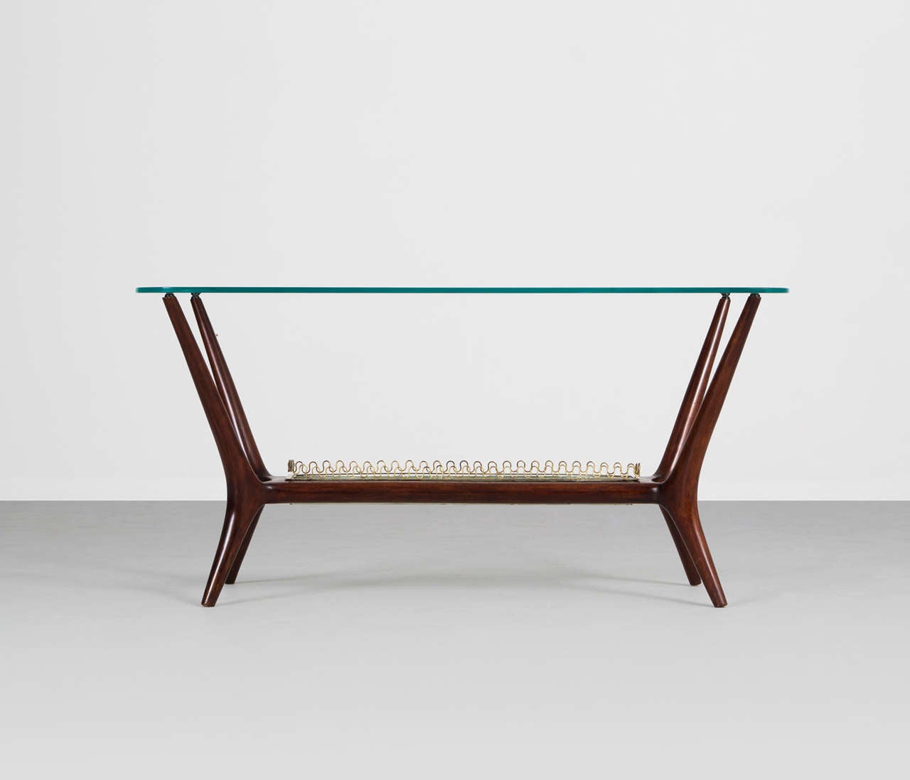 Italian cocktail table with curved glass top For Sale at 1stDibs