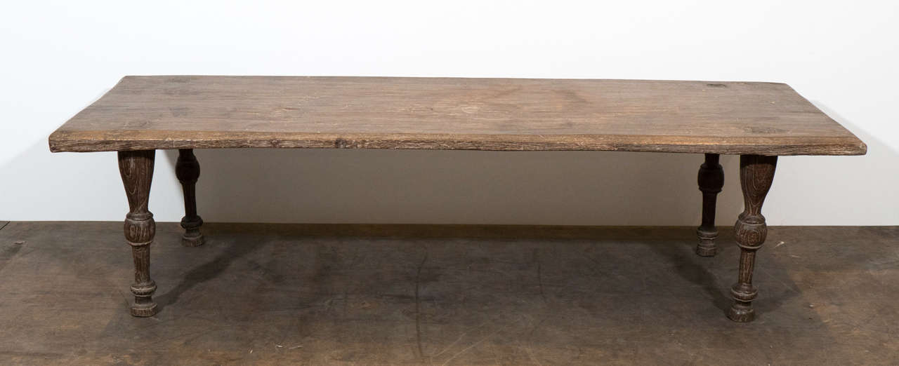 Antique single teak slab top coffee table with hand-carved beveled edge.