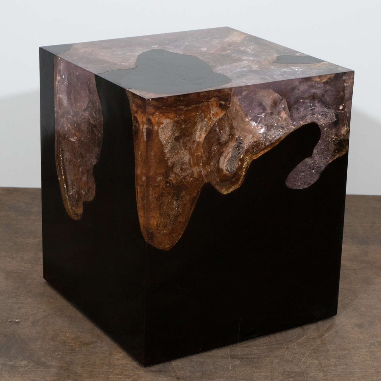 The cracked resin side table is made from reclaimed teak wood infused with resin. A dramatic piece due to the depth of the resin, which resembles a unique quartz crystal with many different facets. An impressive addition to any space.

The Cracked