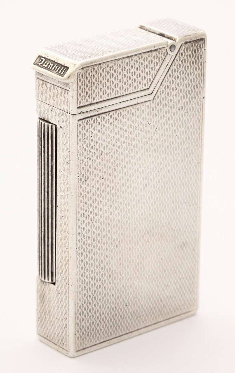 Stunning and very rare Art Deco sterling silver version of the pocket 'Broadboy' Dunhill pocket lighter. The lighter is an iconic and one of the most sought after pocket lighters ever made. It is in superb condition and even has the original 