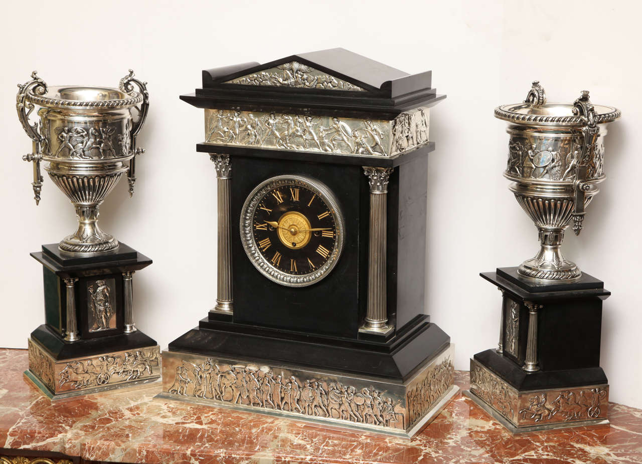 A very fine three-piece neoclassical silvered bronze and black slate marble clock set.
Stock number: CC30.