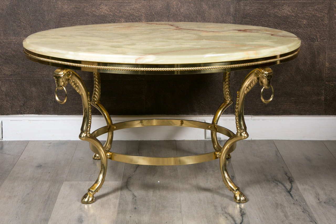 Very elegant pair of 1970 Italian coffee table. Onyx marble tops  and brass bases.