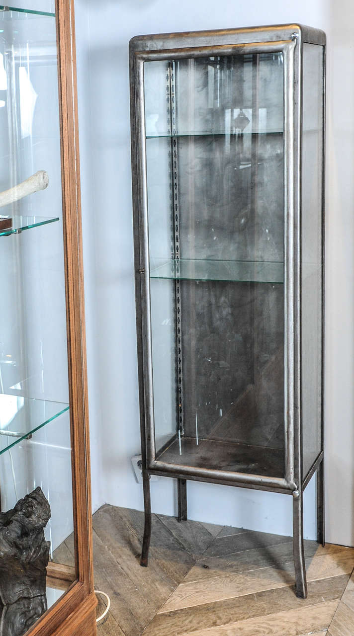 A 1930s French wrought iron and glass display cabinet ...