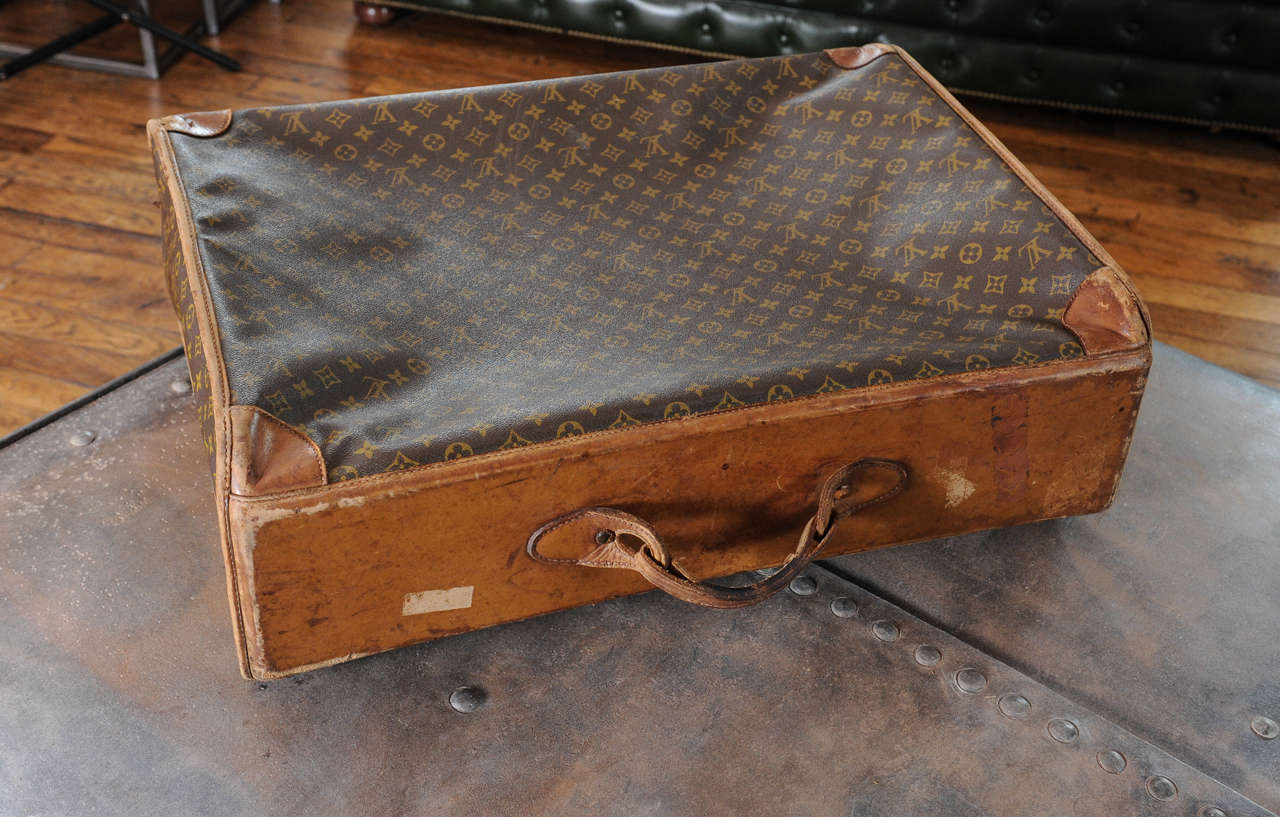 20th Century A vintage Louis Vuitton monogram leather suitcase / luggage