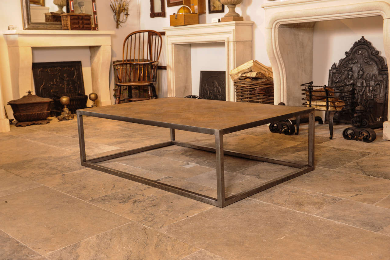A coffee / centre table made of a 19th C. Versailles-pattern marquetry panel
