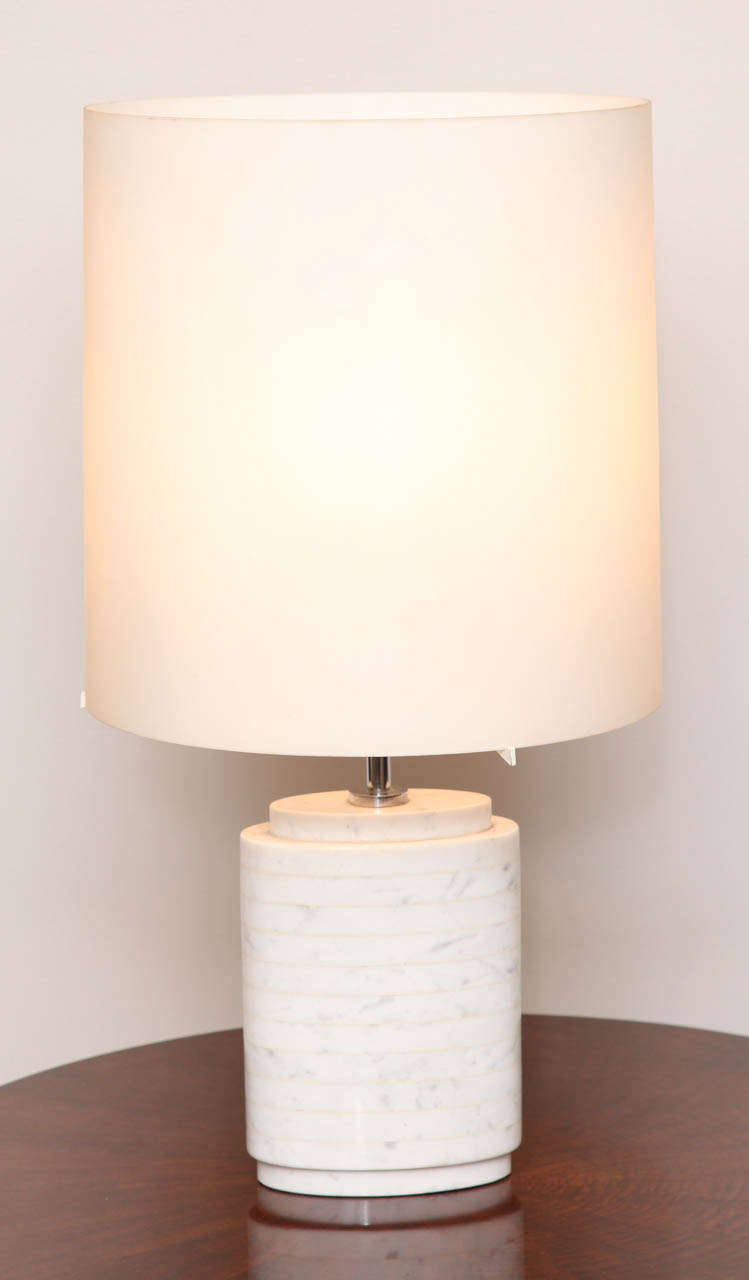 A modern table lamp with white Carrara marble base and original milk glass shade.