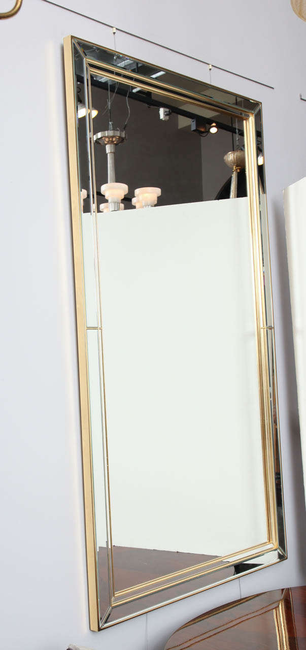 Mid-Century Modern grand wall mirror with double beveled frame.