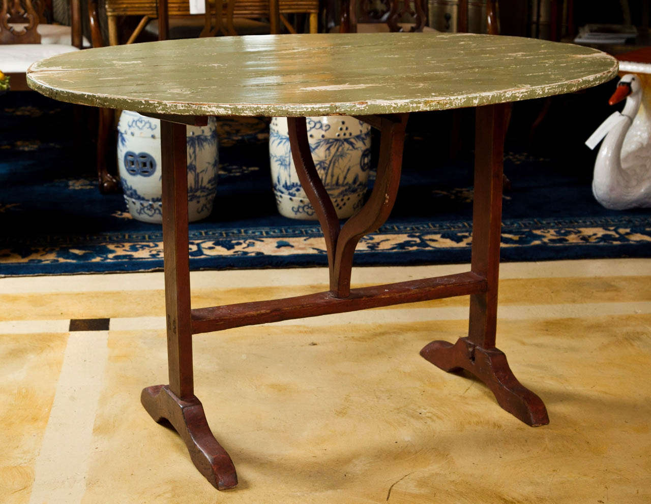 Fabulous French wine tasting table. Original painted top. The perfect touch of rustic for your wine cellar.