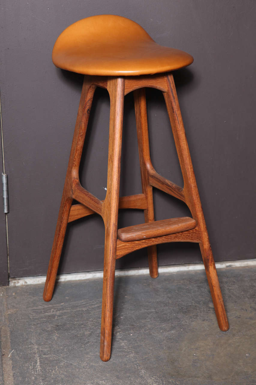 Vintage 1960s Bar Stools by Erik Buch, set of 3

This set of Teak Bar Stools are in excellent condition, and have been newly upholstered in leather. The back is surprisingly supportive so sit up straight comfortably. We found a few so let us know