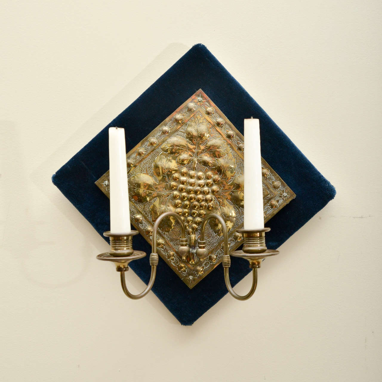 English Diamond Shaped Brass Repousse Sconce on Blue Velvet