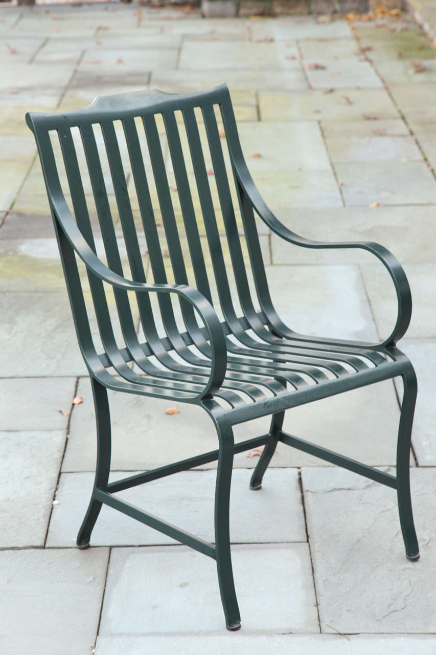 Handcrafted in dark green powder-coated aluminum by McKinnon and Harris of Virginia.  Ten armchairs available.