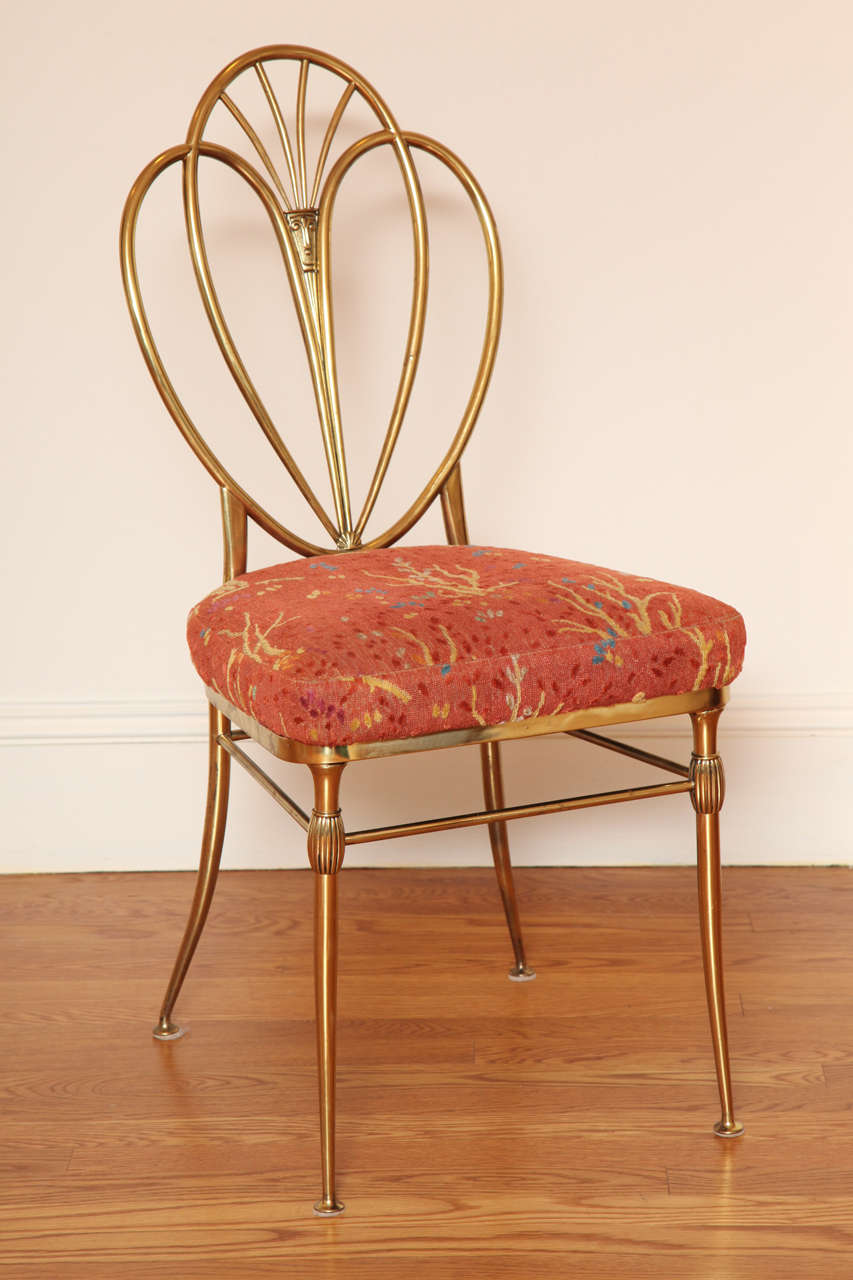 Unusual Hepplewhite style model with shield shaped back; the Clarence House epingle upholstered seat over the tapering legs joined by stretchers.