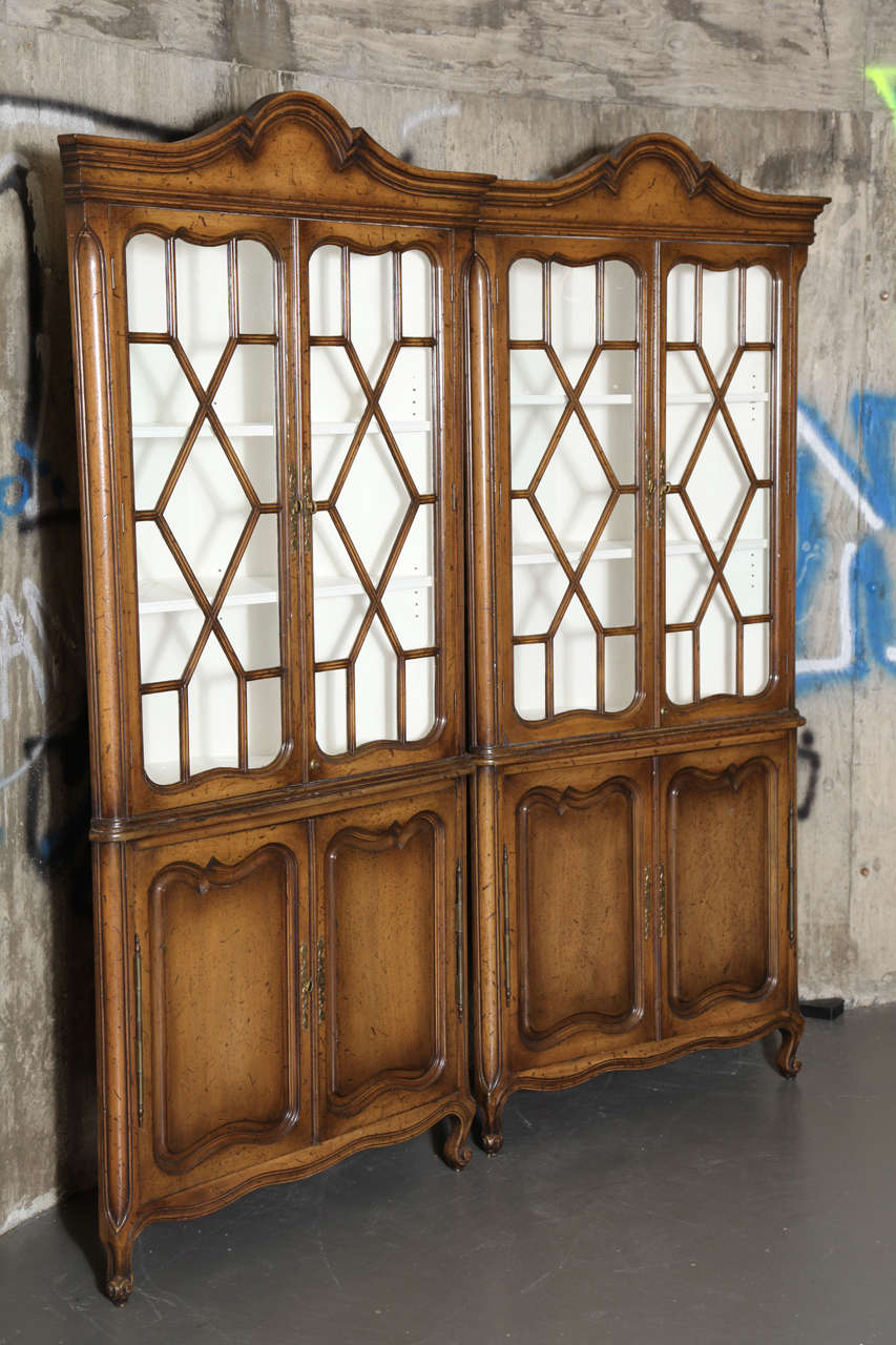 Fine quality construction and wonderful old glass in mullioned doors.  Both upper and lower parts fitted with adjustable shelves.  Beautiful walnut but could  also be transformed by lacquering a color.