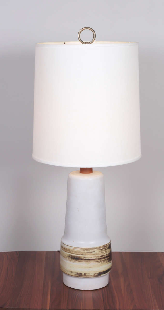 Tall ceramic table lamp with walnut stem by Gordon and Jane Martz, 1950s. Signed at bottom.