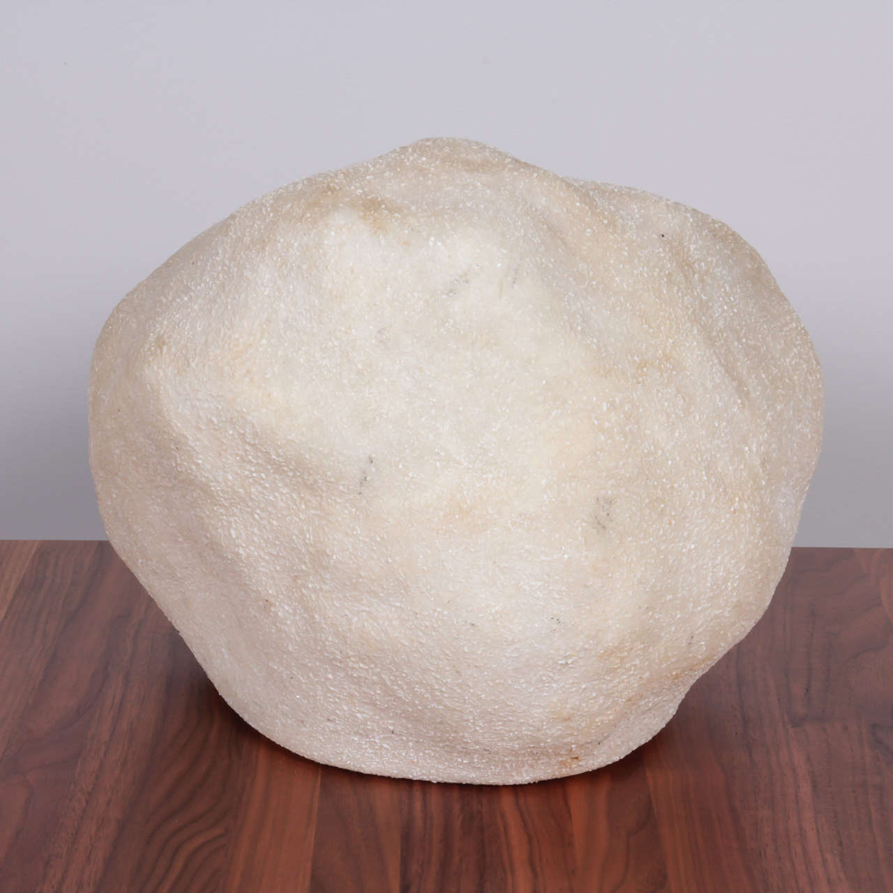 A glowing fiberglass lamp shaped to emulate a rock; can be used on the floor or on table. Manufactured by Singleton, Italian, circa 1970.