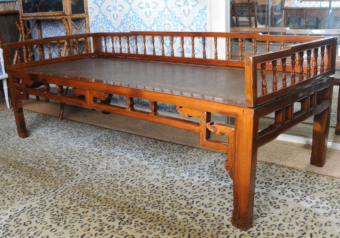 Simple Chinese Elegant Chinese Antique Opium Bed or day bed with woven rattan seat. Beautifully restored and polished condition. From a Bronxville, NY estate.