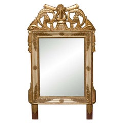 19th Century French Louis XVI Style Crested Gilt Patinated Mirror with Trophy