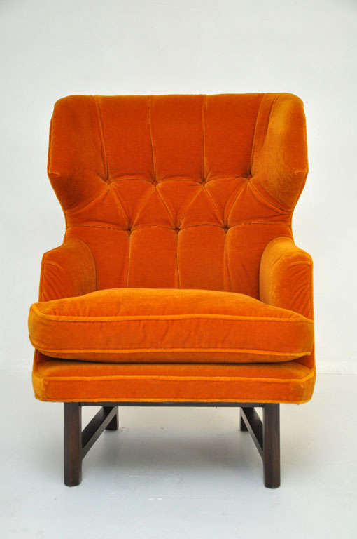 Sculptural wing back lounge chair by Edward Wormley for Dunbar.  All original orange tufted mohair.