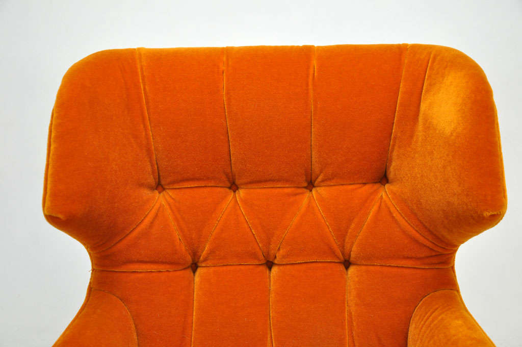 orange tufted chair