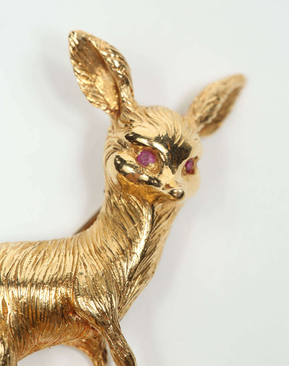 A charming 18k gold fox pin with ruby eyes and nice detailing. Stamped on the back 