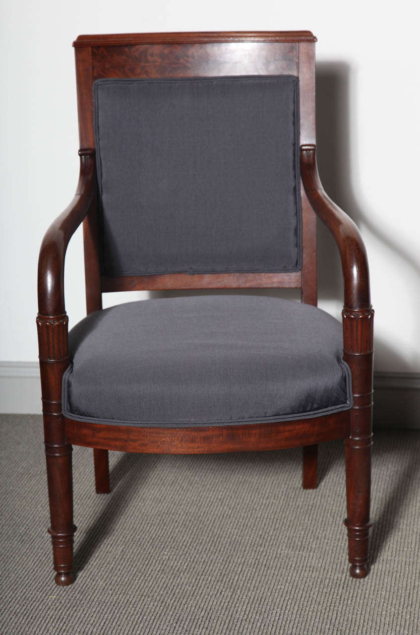French Empire style armchair in mahogany. Newly reupholstered in silk.