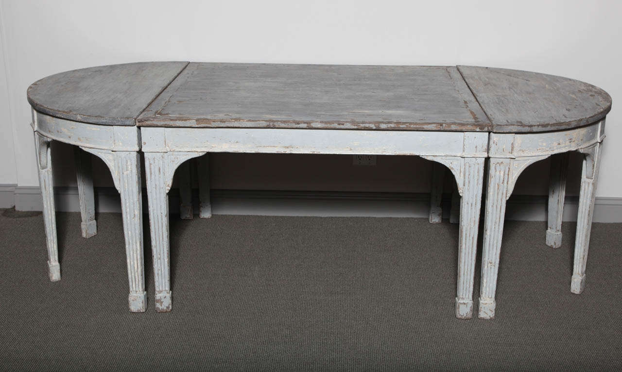 Painted Gustavian Style dining table with a dark grey top and light grey base. Can be used as a single table or separated into a pair of demi lunes with drawers and a central table.