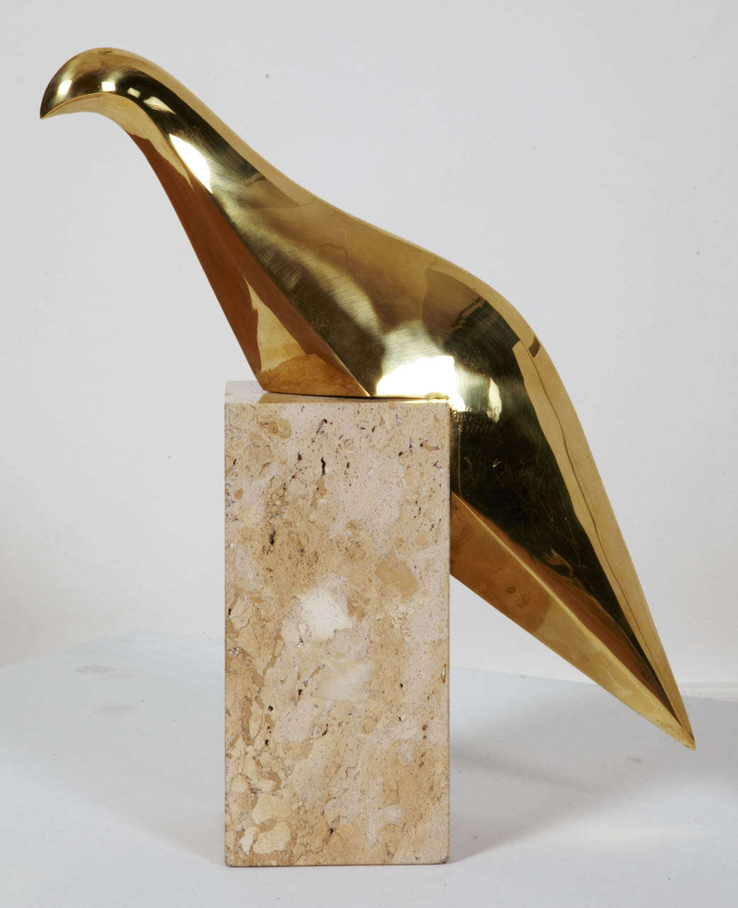 Gilt polished bronze bird, 1980, by Philippe JEAN (France)
Perched on a travertine marble base.
Signed, numbered, dated.