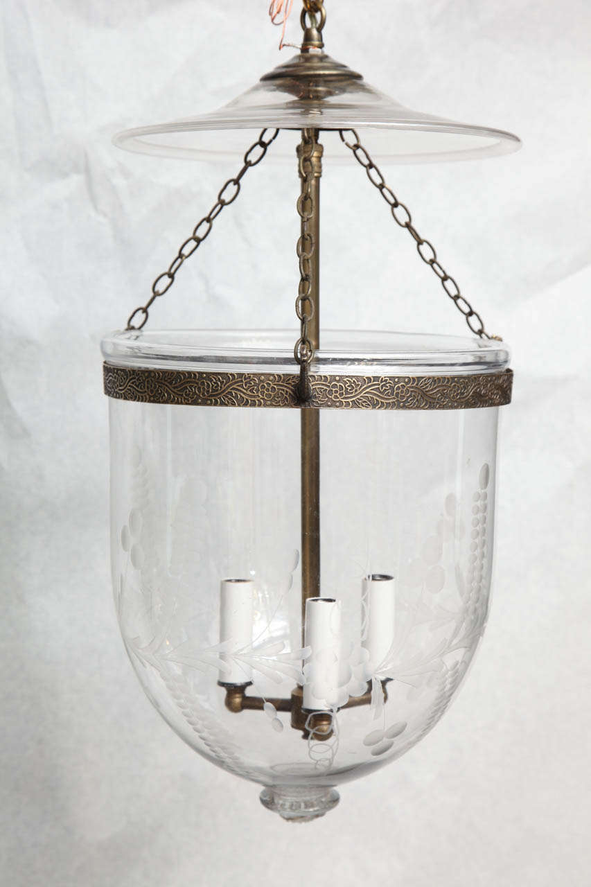 Antique glass bell jar with etchings