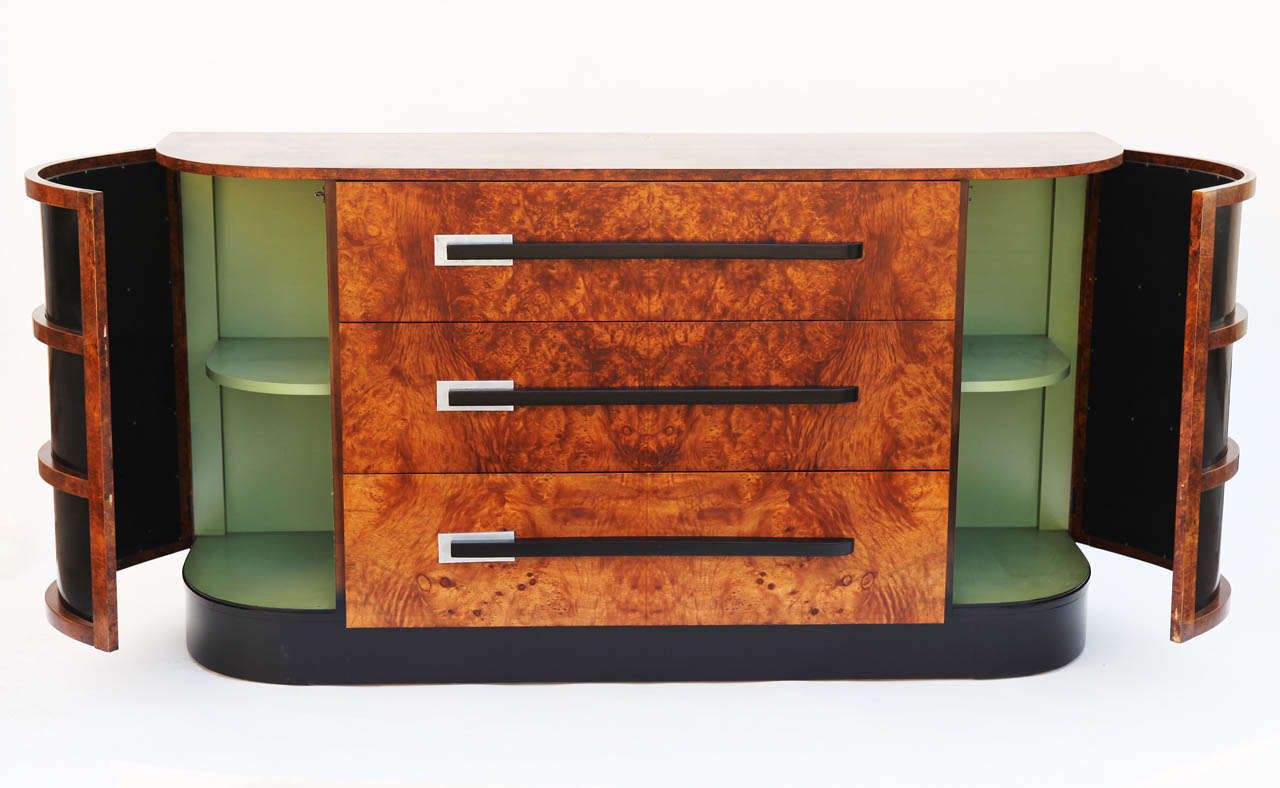 MASSIVE Machine Age Art Deco Hastings Sideboard by Donald Deskey or Walter Dorwin Teague streamline design

This one has some of the finest holographic, split and book-ended original burl we've seen in American Art Deco. Also, an amazing figured top
