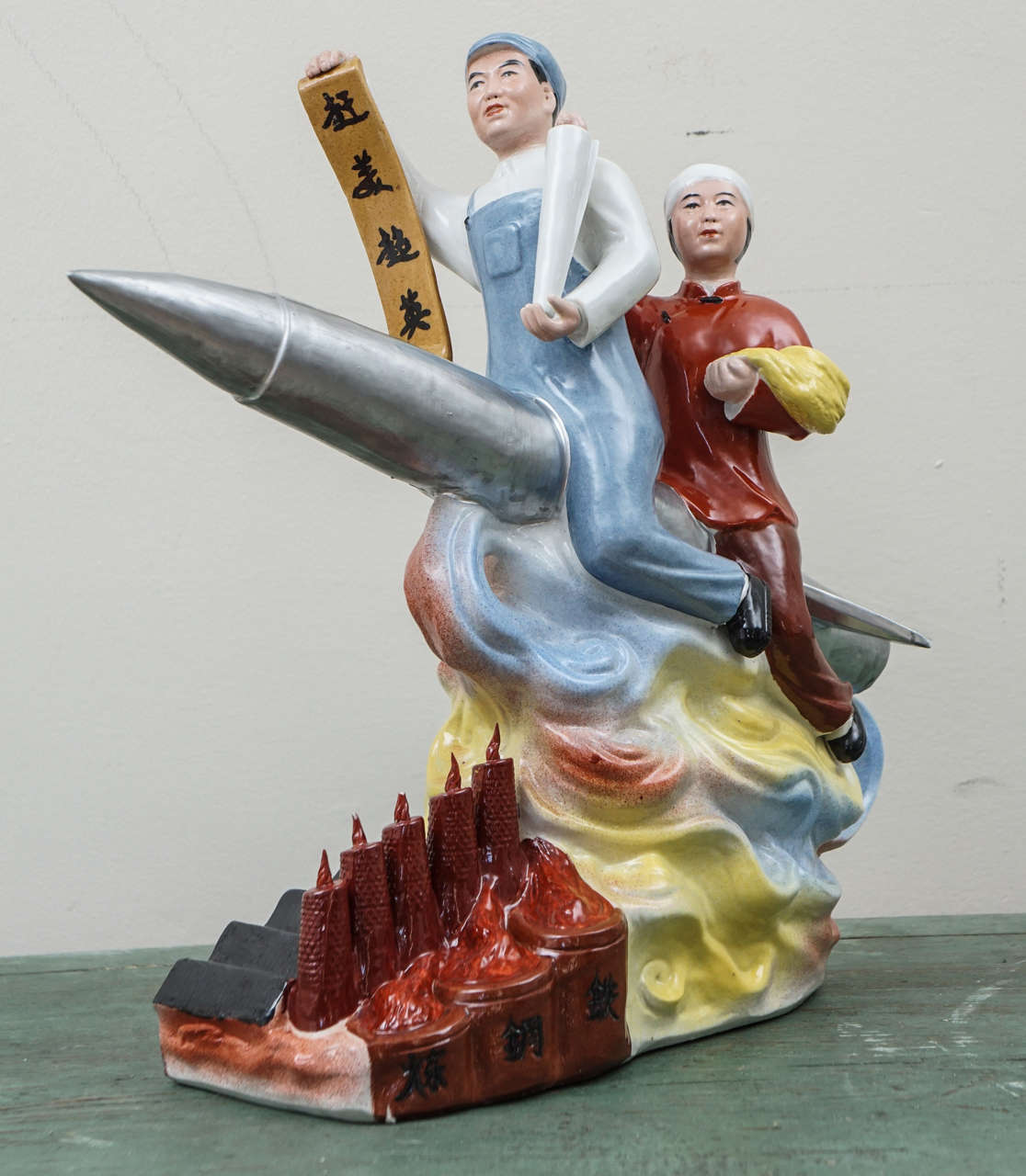 This Bold and Beautifully Colored Ceramic Shows an Enthusiastic Chinese Couple Aboard a Missile.  The Banner  (loosely translated) Reads  