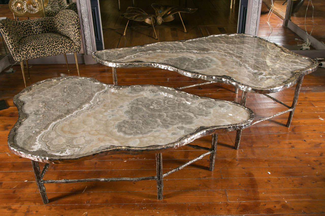 Pair of low tables, puddle shape, top in Meteorite onyx; the tables of different heights can be fitted together in one large table. Gallery Glustin creation, limited to 12 pieces.
Each pair can have a slight different drawing on the top.
Different