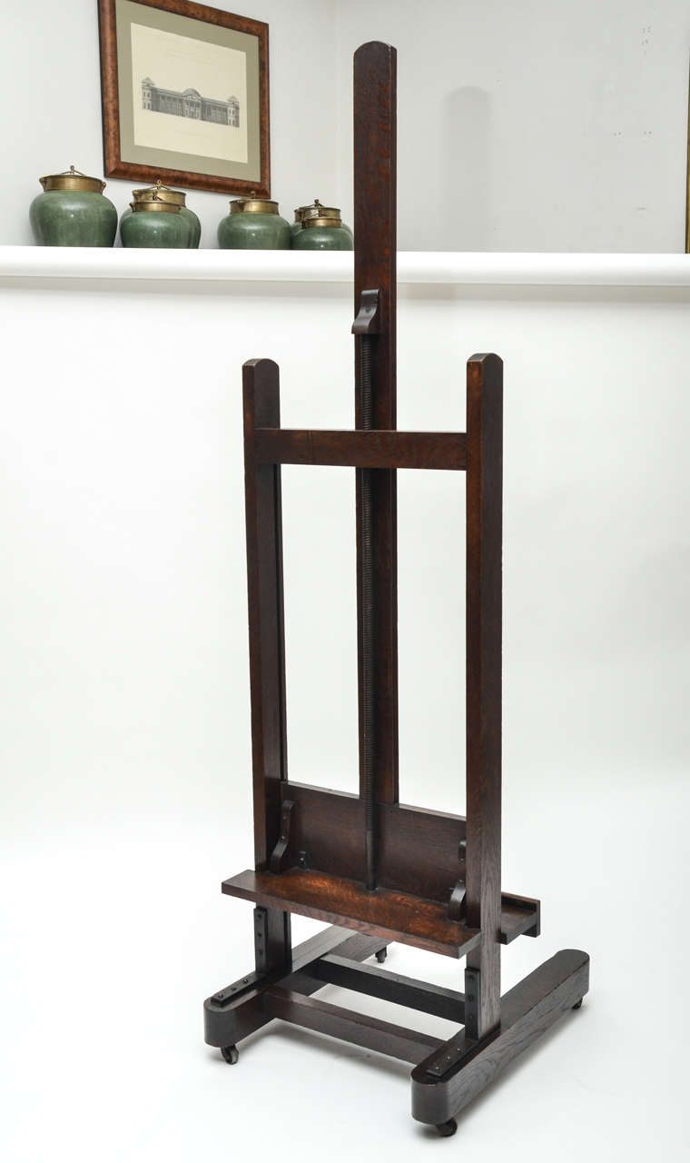 A 19th century English oak artist's easel with working winding mechanism, walnut cranking handle.
