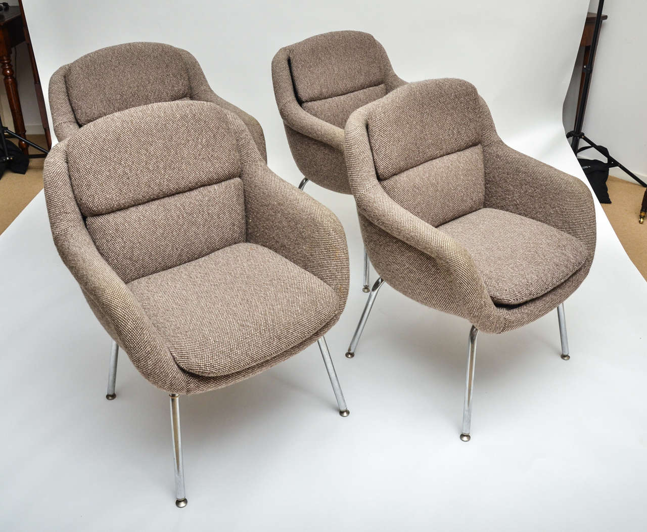 A 1970s set of four upholstered armchairs with chrome legs and original fabric. A pair is available for $2,500.