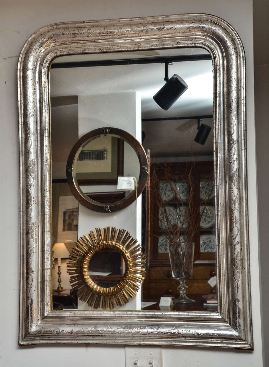 A 19th century Louis Philippe silver giltwood mirror with etched decoration.
