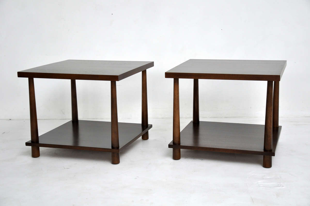 Pair of end tables by T.H. Robsjohn-Gibbings. Fully restored and refinished.  Beautiful dark walnut finish.