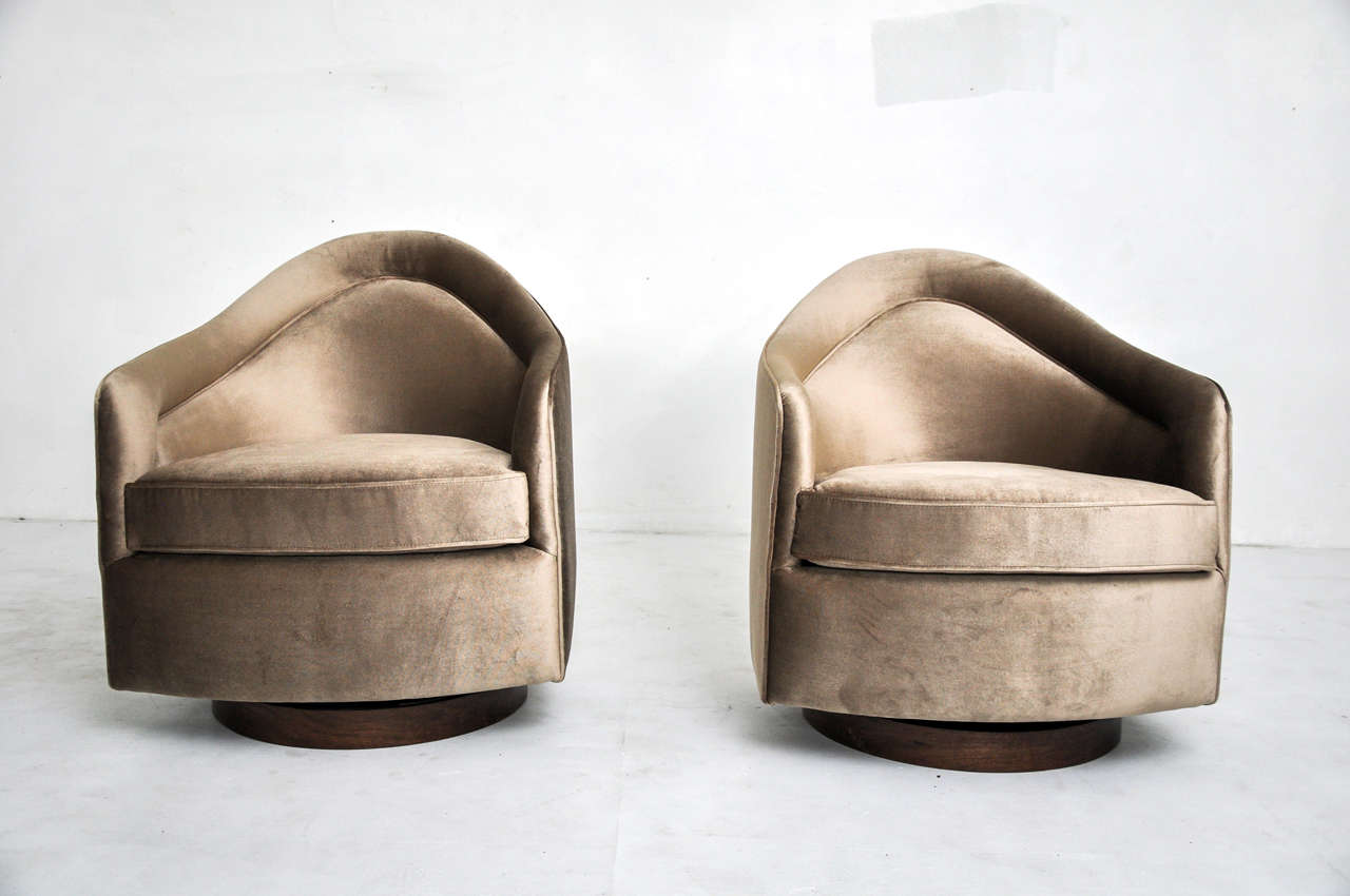 Pair of rock and swivel chairs by Milo Baughman.  Fully restored and reupholstered.