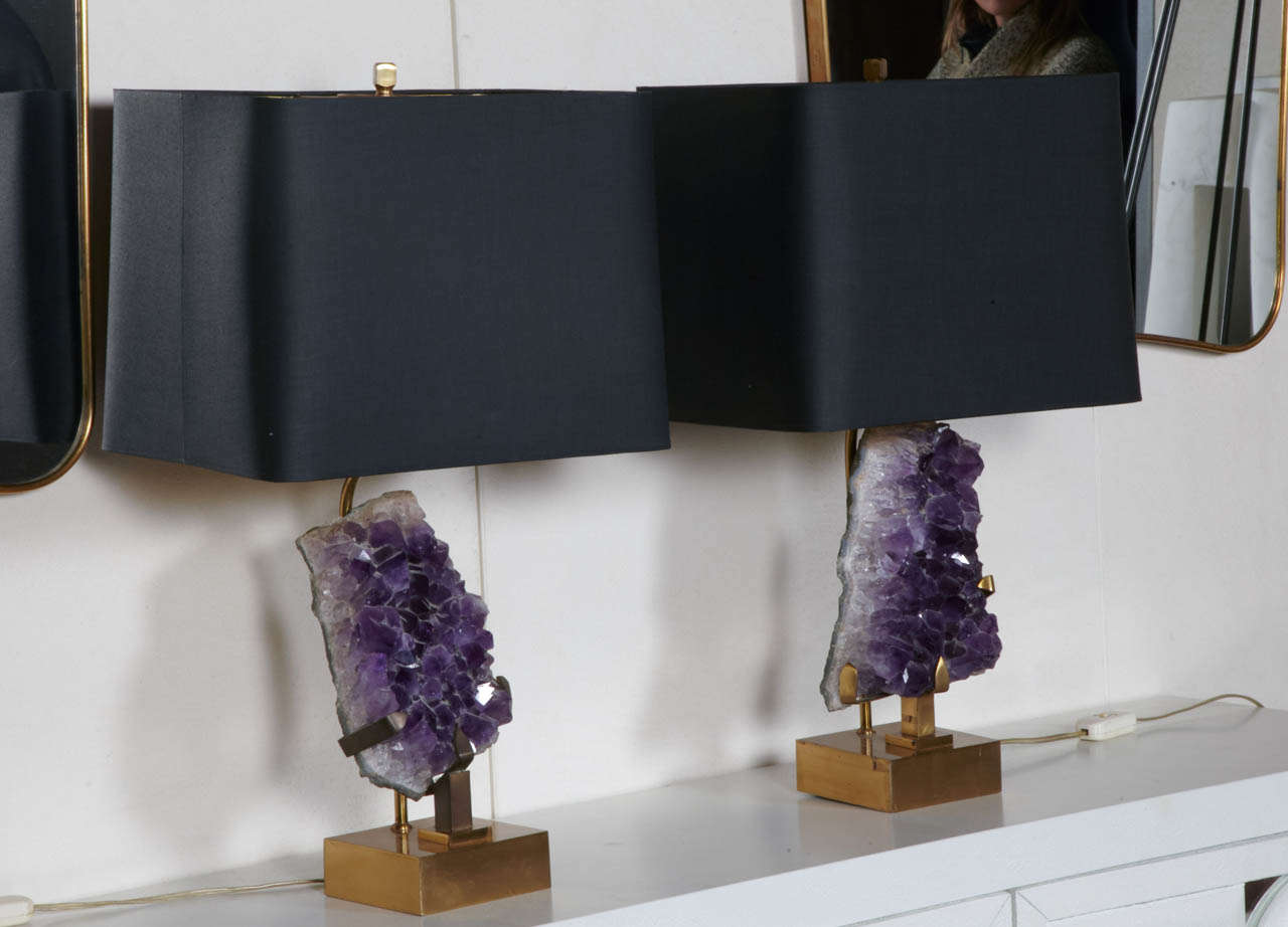French pair of table lamps with large decorative amethyst stones mounted in brass base with black and gold adjustable shades.

Circa 1970

Bases : 52 x 12 x 8 cm 

With Shade : 59 x 35 x 25 cm