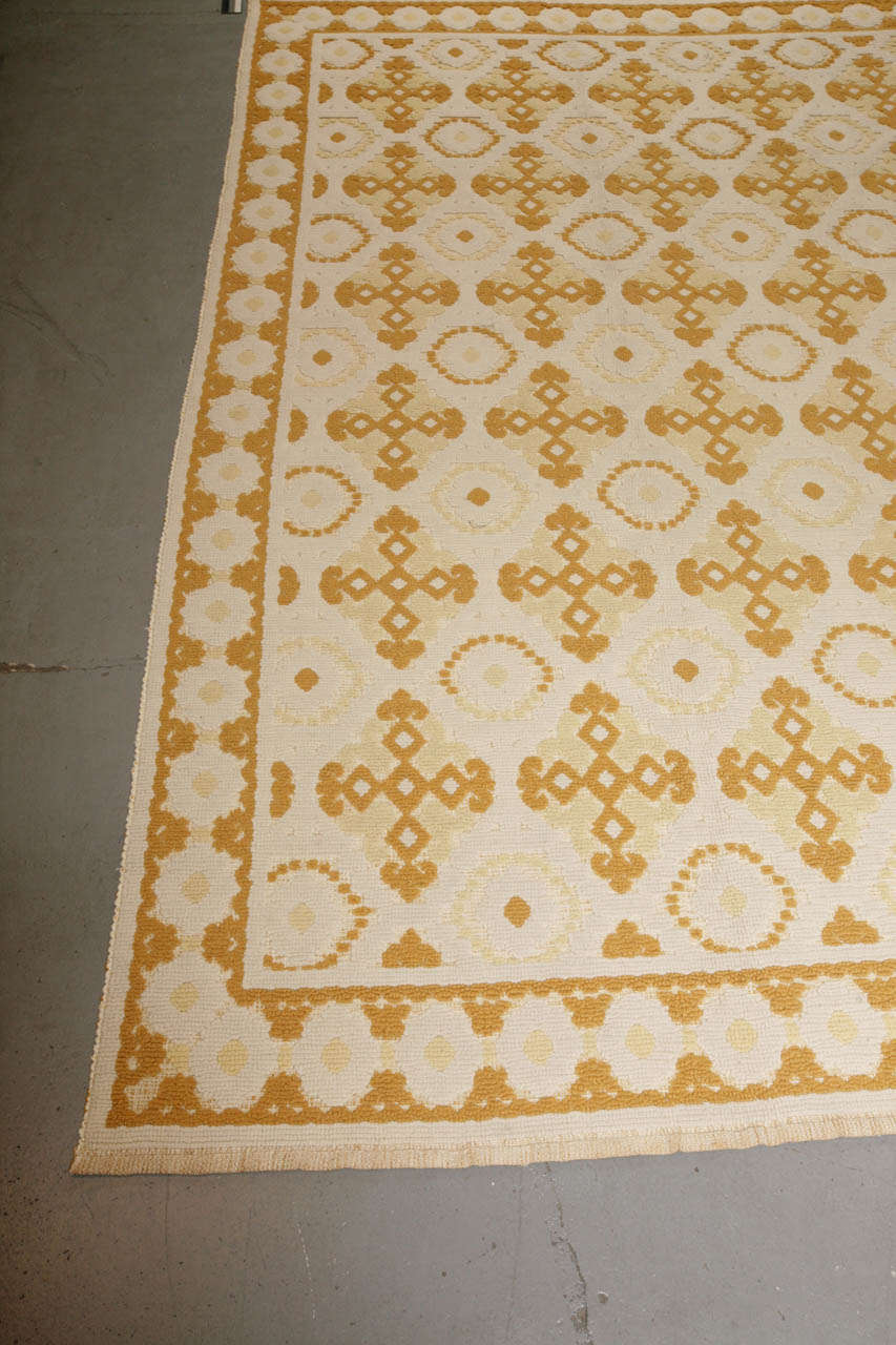 An elegant and decorative rug, unusually light, with a simple design and rare square shape format. It is in excellent condition.