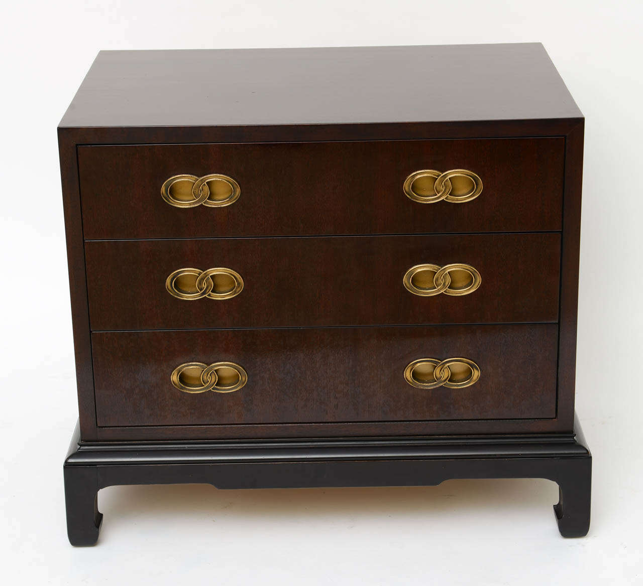 REDUCED FOR SATURDAY SALE from $2800...In the style of Michael Taylor and bedside table sized, this fine mahogany three drawer small chest of drawers has an oriental flair in the shaped legs and inset brass drawer pulls.  Incredible craftsmanship