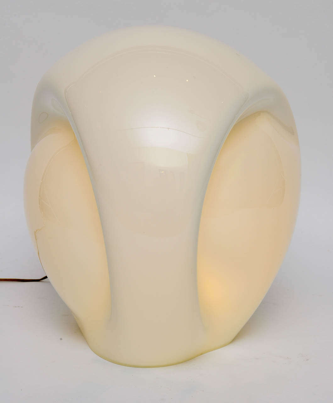 A 1978 design by Luciano Vistosi, this Munega blown glass sculptural lamp can be a table lamp or because of the large size, a floor lamp. Free-form blown and cased Murano glass, the light is immaculate, has been rewired and has a high-lo switch on