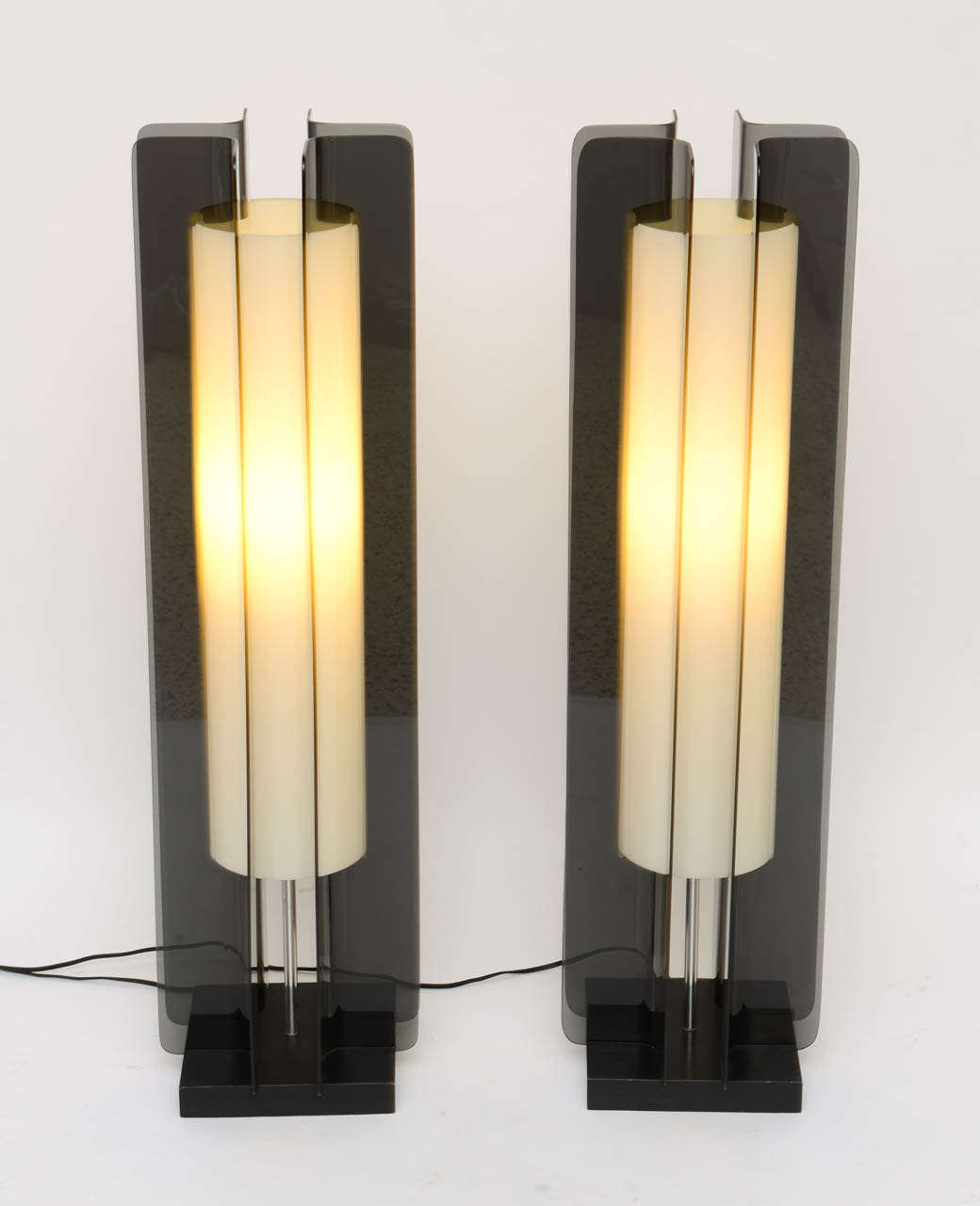 SOLD  Significant, very modern and architectural, this pair of towering table lamps or floor lamps in smoked acrylic or lucite stand tall at 36
